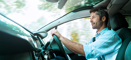 Man driving a car.