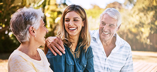 Young woman with her elderly parents at the pool